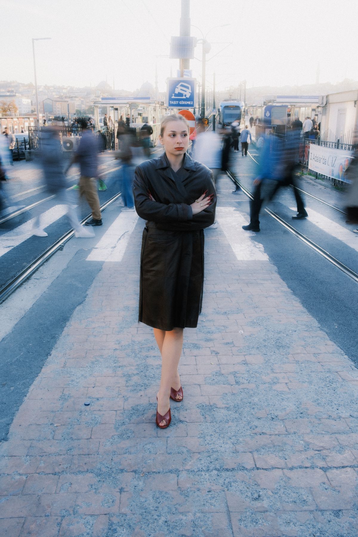 One person in focus amid a blur of passersby, the decision made